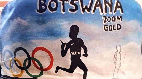 Painted runner silhouette with Botswana lettering and colored rings.