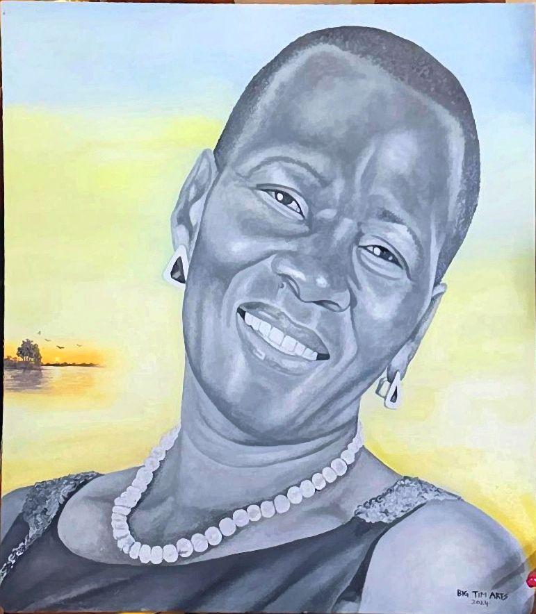 Smiling woman wearing a bead necklace against a pale yellow background.