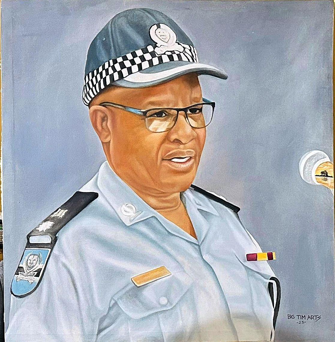 Person wearing glasses and a blue uniform with a checkered cap band.