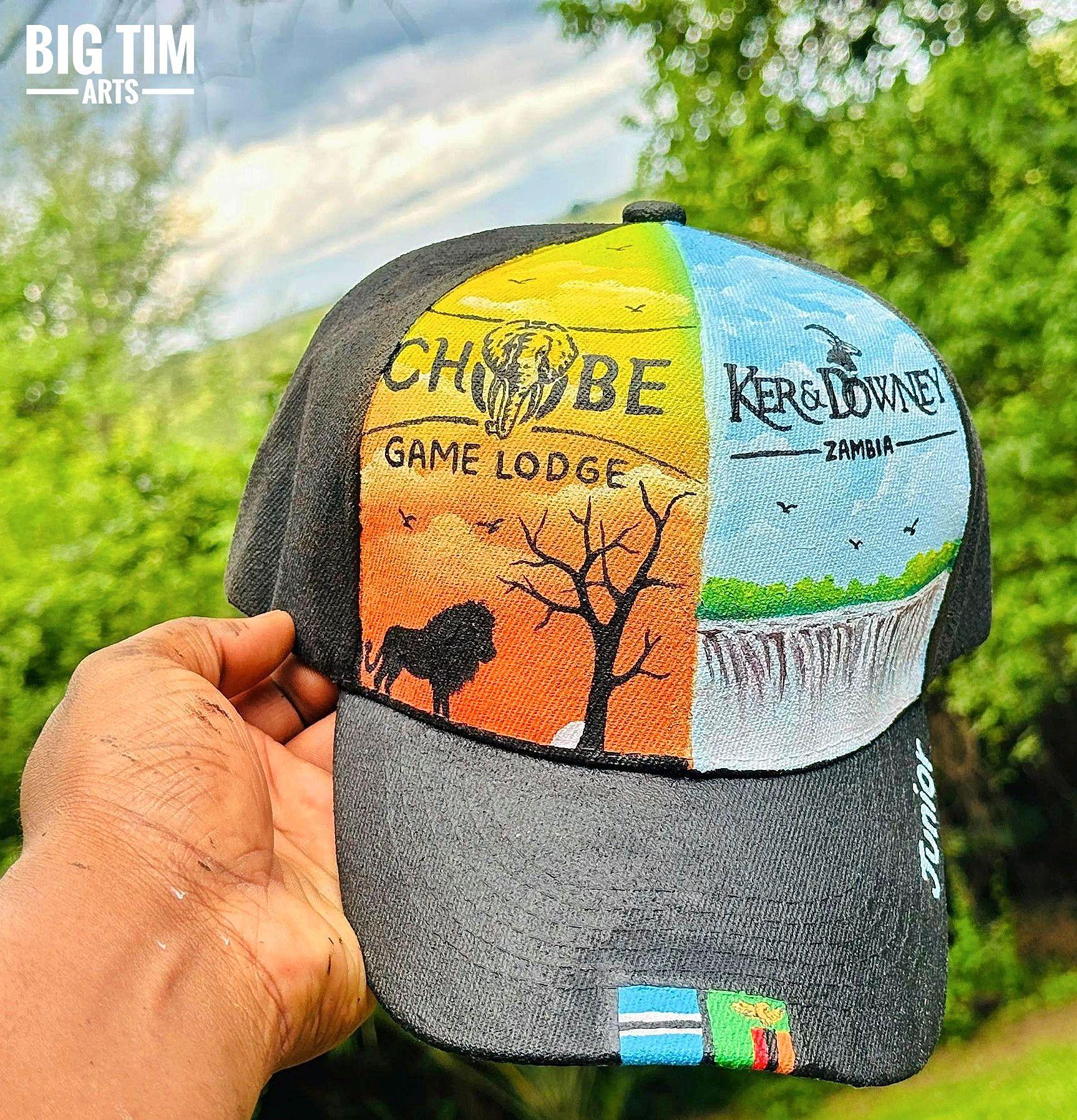 Animal silhouettes, a bare tree, and a waterfall across two cap panels.